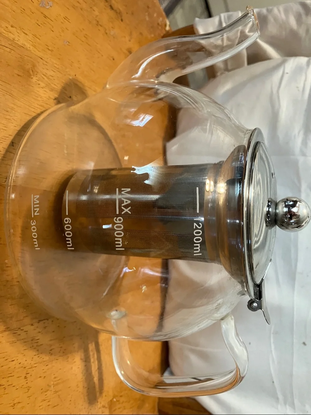 Like new. French press style glass tea pot with stainless steel pieces